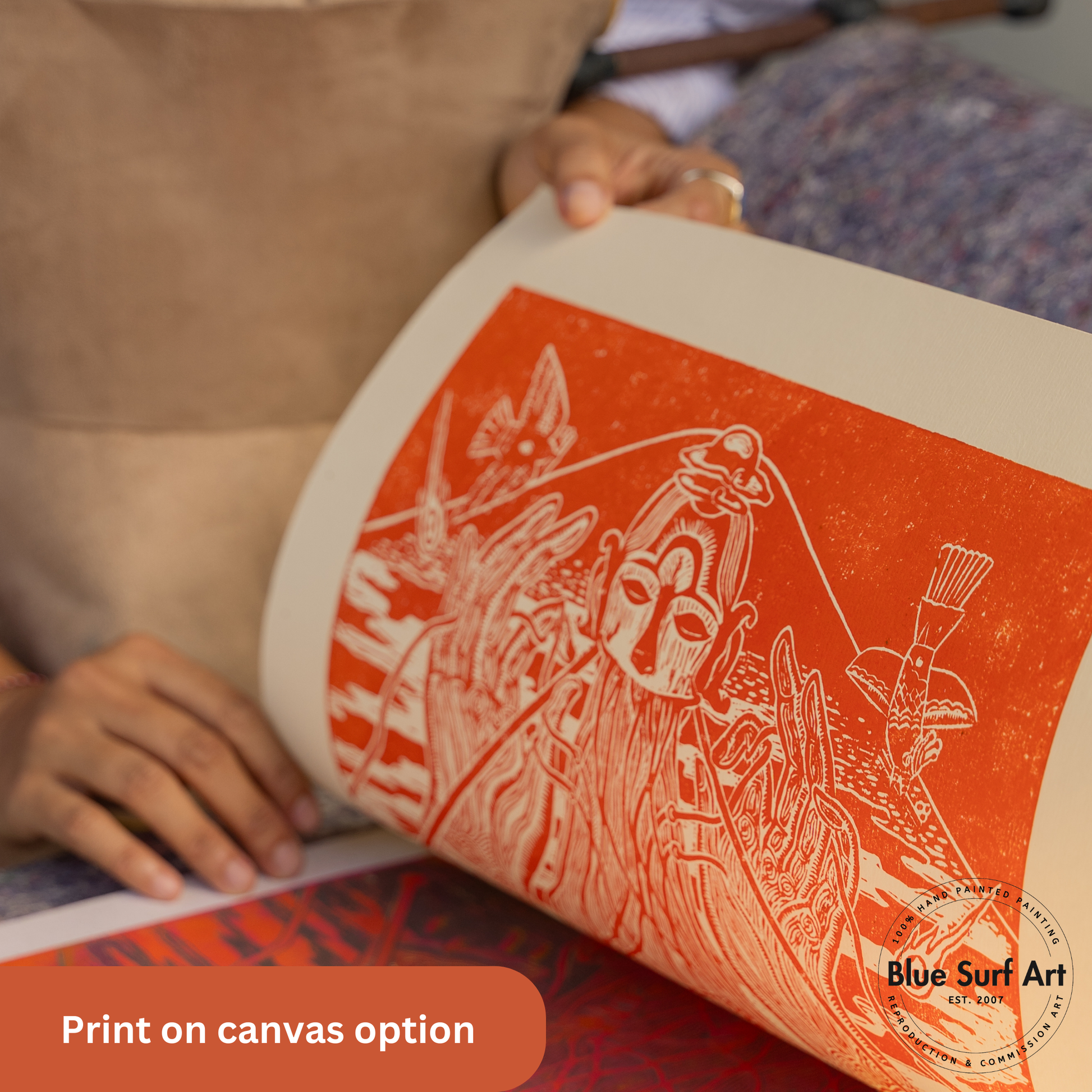 Person holding a rolled-up canvas print with artistic design, featuring 'Blue Surf Art' branding.